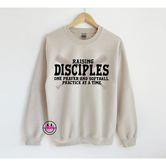 RAISING DISCIPLES ONE SOFTBALL PRACTICE AT A TIME - CREWNECK SWEATSHIRT SAND
