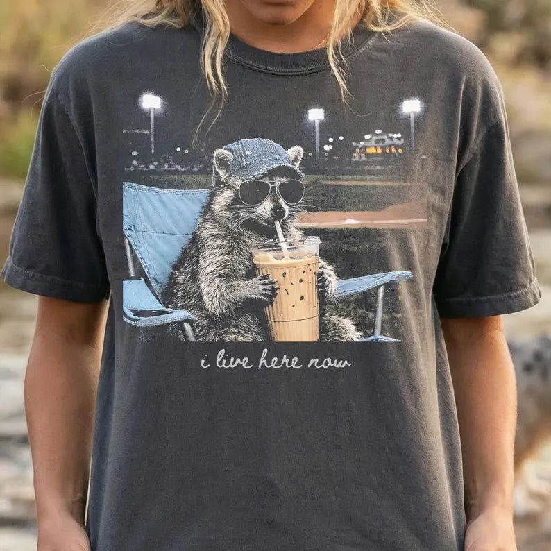 I Live Here Now Raccoon Tee – Ballfield Edition 🦝☕