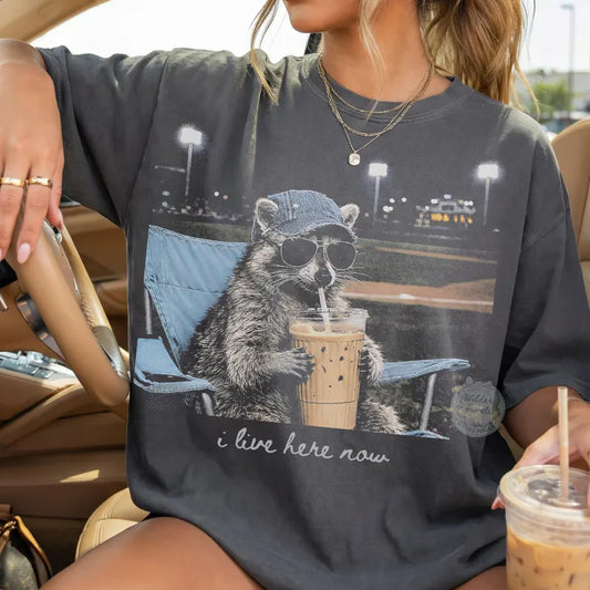 I Live Here Now Raccoon Tee – Ballfield Edition 🦝☕